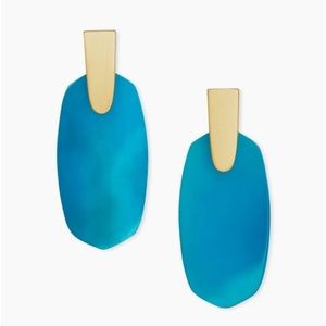 Kendra Scott silver teal argon drop earrings.